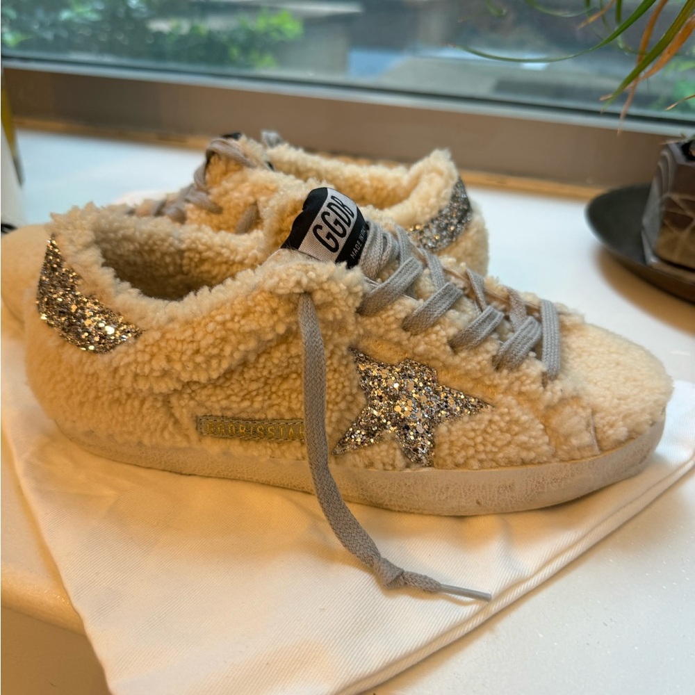 Brand new never worn shearling Golden Goose superstars with silver sparkly star